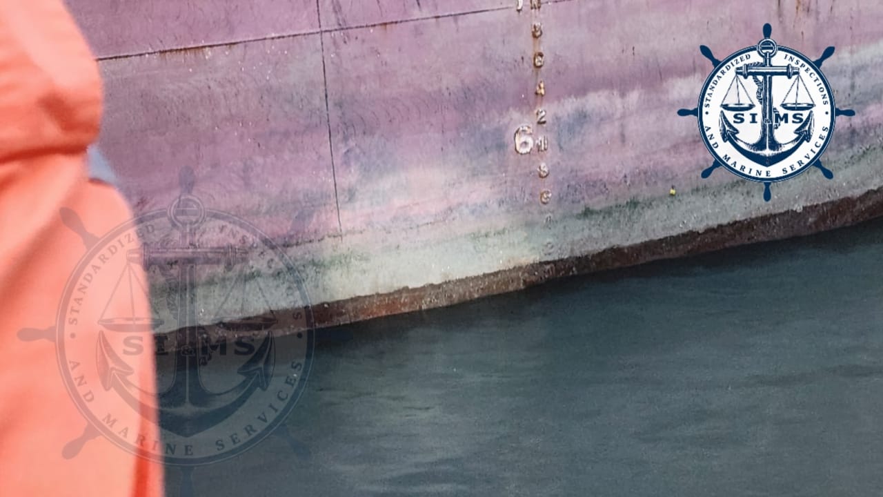 Draft marks on the vessel's hull at the waterline